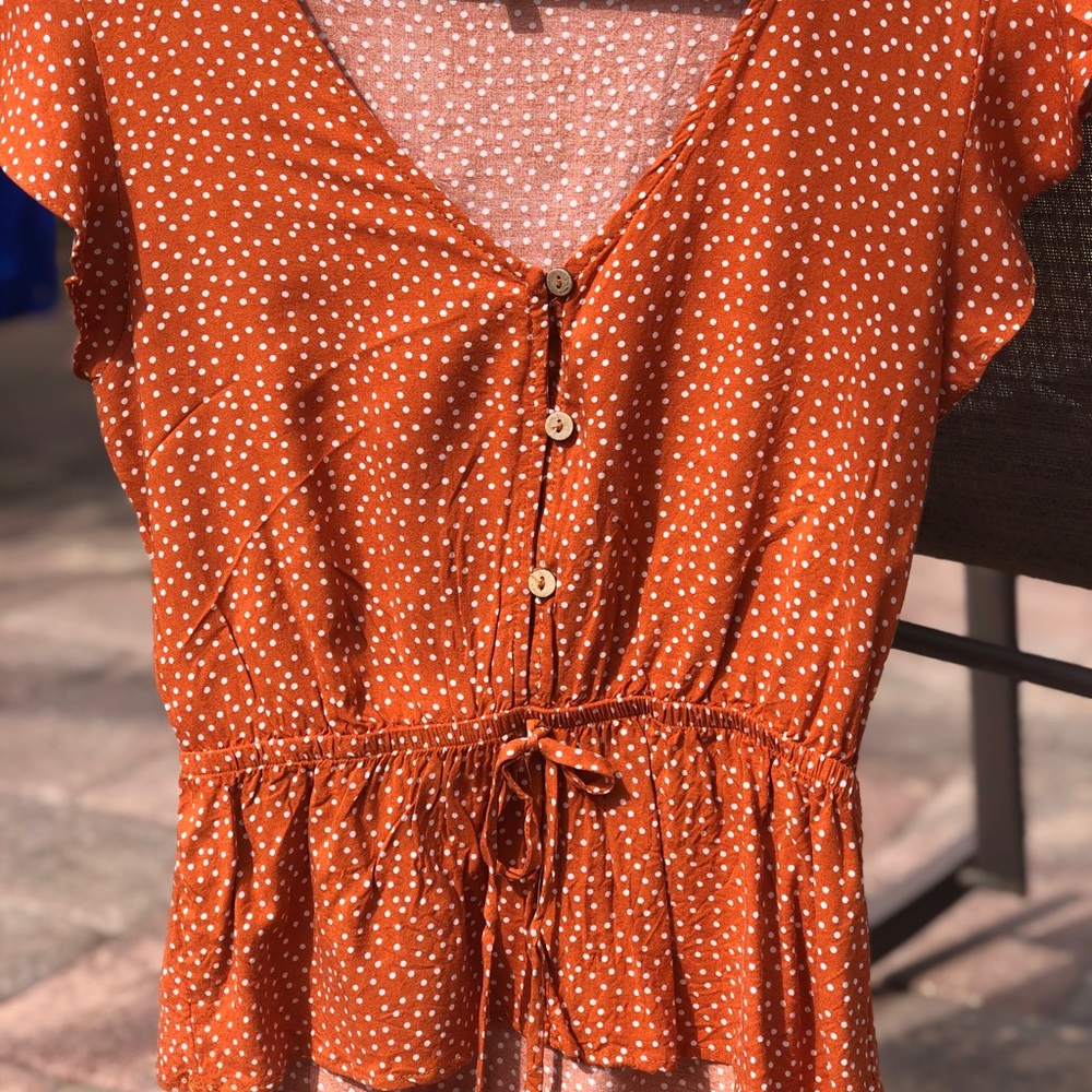Women’s orange polka dot blouse